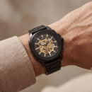 Luxury Black Skeleton Automatic Men’s Watch with Gold Mechanical Dial & Matte Steel Bracelet